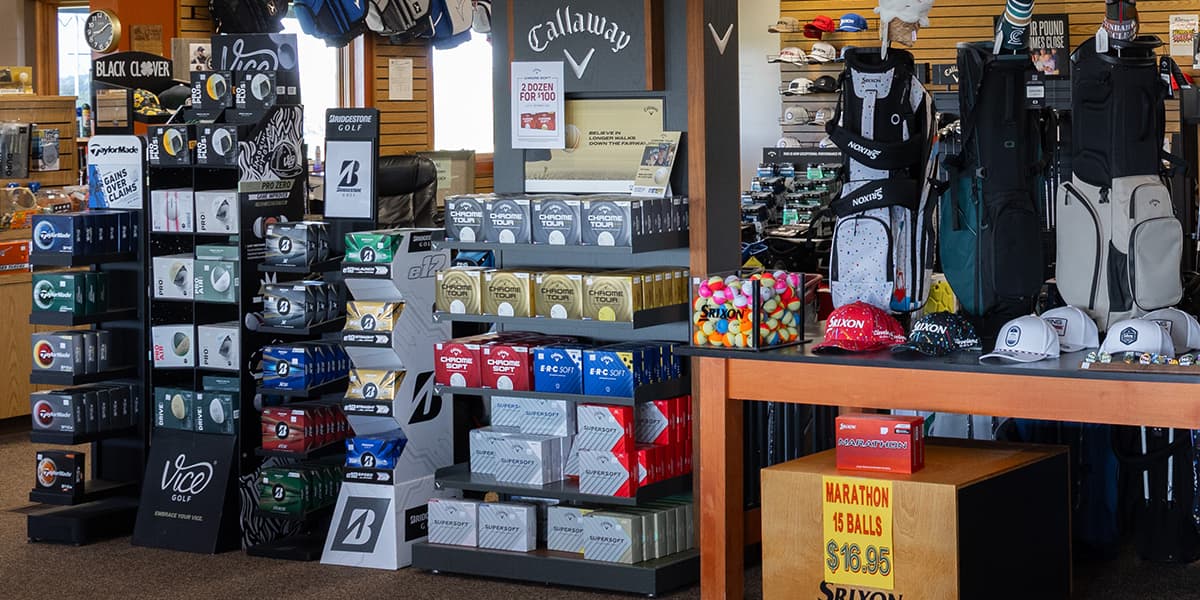 Interior of the Crooked Creek Golf Club Pro Shop featuring golf clubs, apparel, accessories, balls, and equipment from top brands.