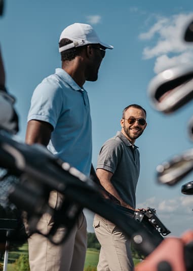 Golfers gather near golf carts and club bags before a league match or tournament event at Crooked Creek Golf Club in Lincoln, Nebraska.
