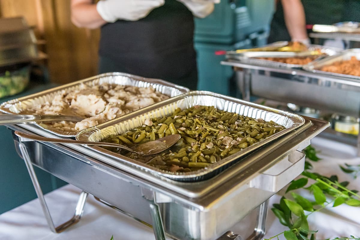 Buffet side dishes including green beans and mashed potatoes prepared for weddings, banquets, tournaments, and special events at Crooked Creek Golf Club.